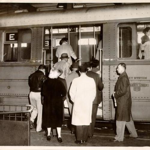 [Passengers boarding a Key System train to cross the San Francisco-Oakland Bay Bridge]