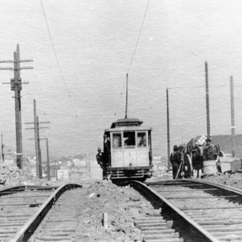 [Cable car along tracks on Fillmore street hill]