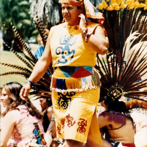 [Woman in Aztec costume for Xilonen Aztec dance celebration at Dolores Park]