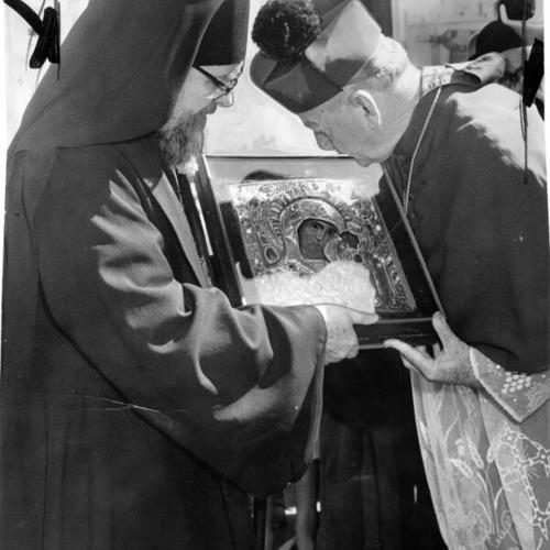 [Archbishop Joseph T. McGucken kissing the Holy Ikon of Our Lady of Kazan enshrined in St. Boniface Church]