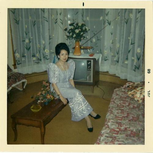 [Grandmother Leonor Gloria before a party, dressed in butterfly sleeves]