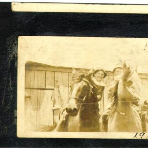 [Two children riding horses in Visitacion Valley]