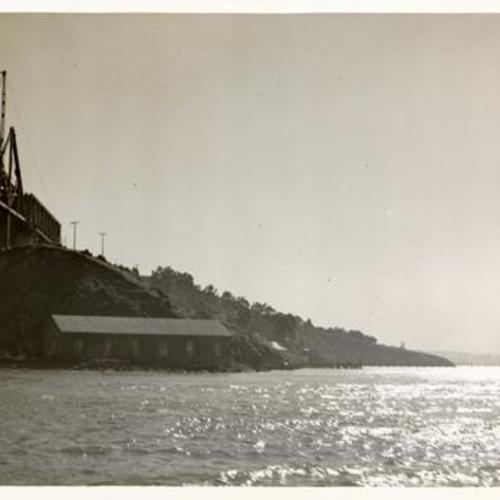 [View from below looking westward at part of East Bay Crossing cantilever span under construction for San Francisco-Oakland Bay Bridge]