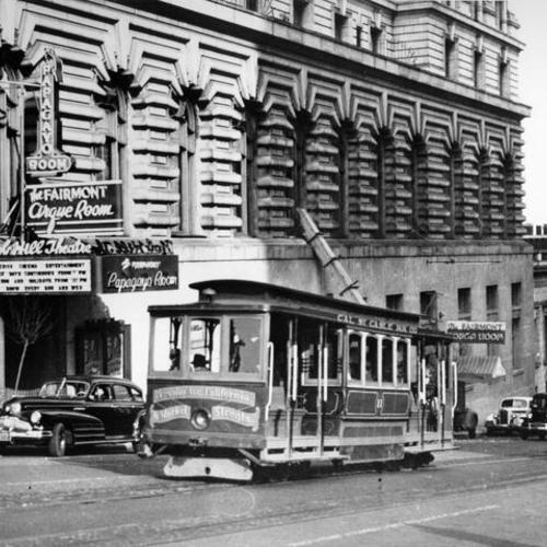 [Cable Car passing in front of the Nob Hill Theatre]