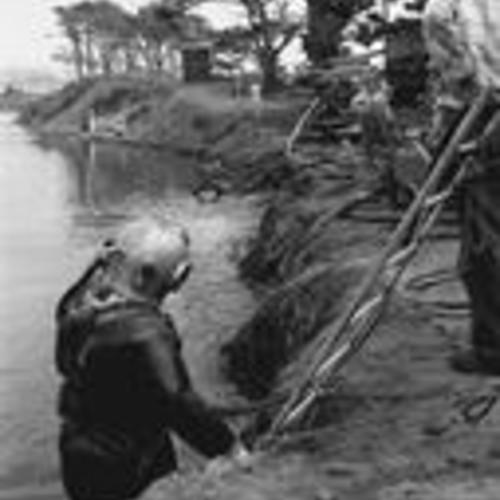 Cleaning 44" pipe and brick work in dam between north and south Lake Merced (1960)
