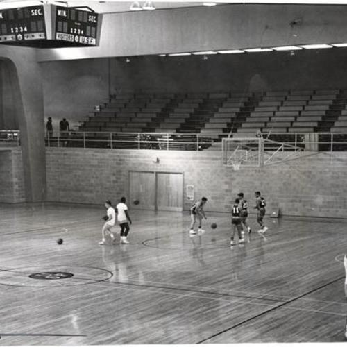 [University of San Francisco basketball team practicing in new gymnasium]