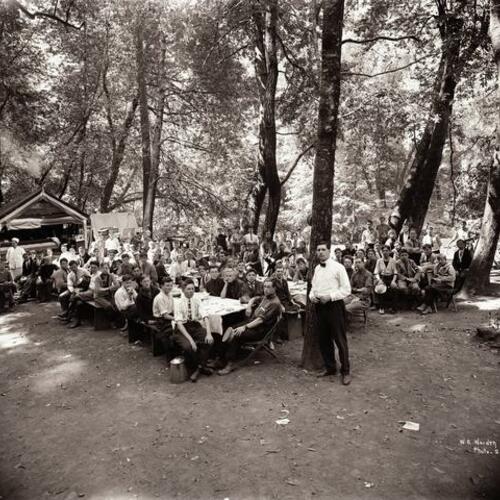 People gather for meal outside at Camp McCoy