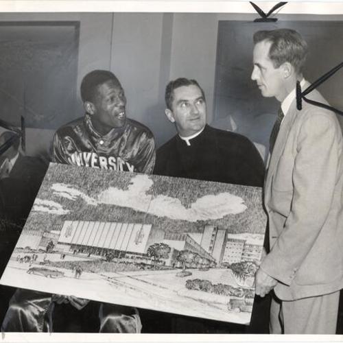 [Bill Russell, Reverend John F. X. Connolly and Phil Woolpert looking at an architect's drawing of a proposed new gymnasium at the University of San Francisco]