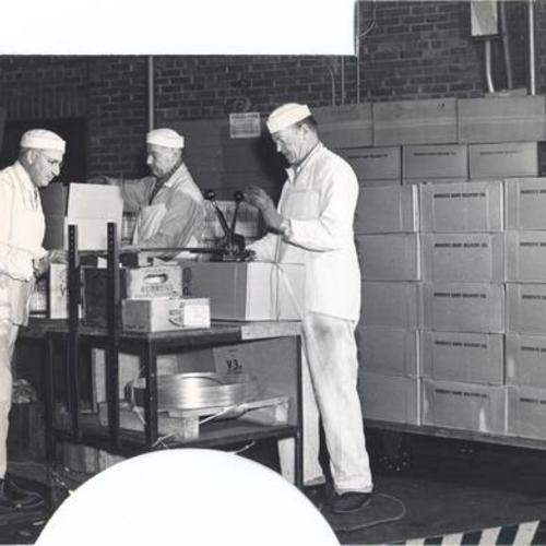 [Workers packaging milk into cases at the Borden Company Plant at 1325 Potrero Avenue]