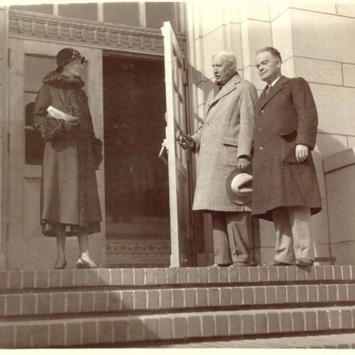 [City architect presenting James Lick Junior High School to President and Commissioner of Board of Education]