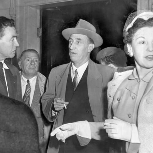 [Harry Bridges accompanied by his wife, Nancy and attorney Vincent Hallinan]