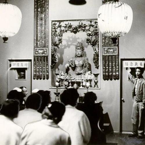 [Raymond Louie giving a tour of the Kwan Yin Temple in Chinatown]