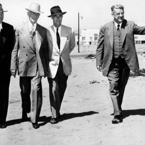 [Dr. N. L. Engelhardt pointing out the proposed site for the Ulloa School at 41st Avenue and Vicente Street to Dr. Karl Schaupp, Adrien Falk and Dr. Herbert C. Clish]