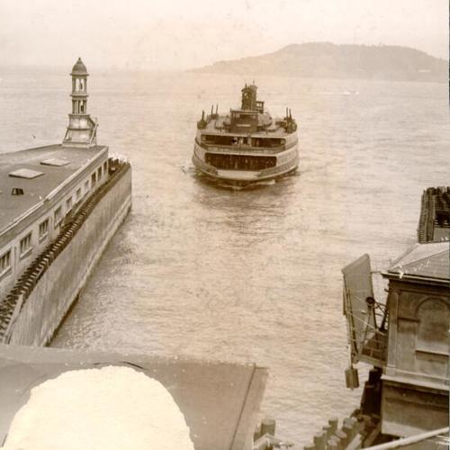 [View of ferry boat approaching the pier]