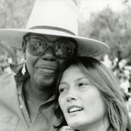 [Adrienne Fuzee, curator for the San Francisco Arts Commission, and Barbara during Gay Pride Parade at Civic Center in 1986]