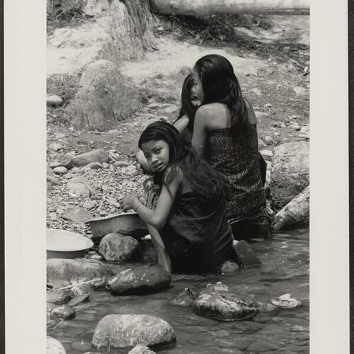 Laotian children bathing in river