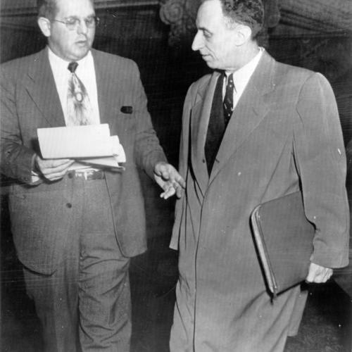 [Harry Bridges being served papers by Frank L. Meyer (left), U.S. deputy marshal]