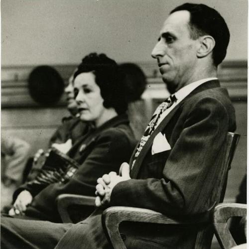[Harry Bridges and Mrs. Agnes Bridges sitting in the courtroom during the opening of their divorce suit]