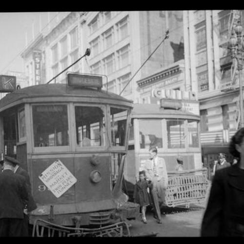 [Scene of a traffic accident involving a MUNI streetcar and MUNI bus at McAllister and Market Street]