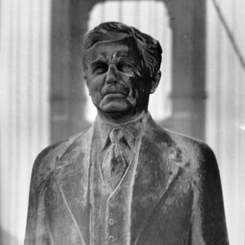 [Statue of Joseph B. Strauss with the Golden Gate Bridge in the background]