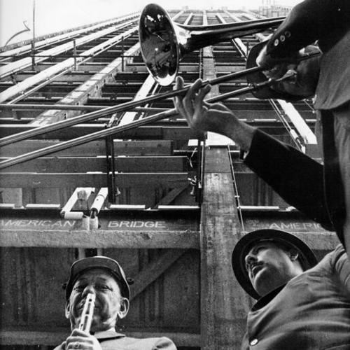 [Musicians playing at a "topping off" ceremony during the construction of a 43-story Wells Fargo Bank building at Sutter and Montgomery streets]