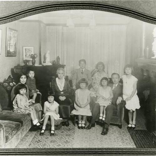 [A portrait of a family in their living room in the 1920's]