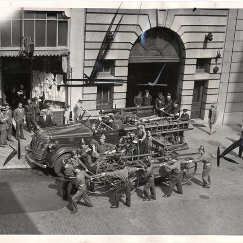 [Antique fire engine on display outside firehouse at 460 Bush Street]