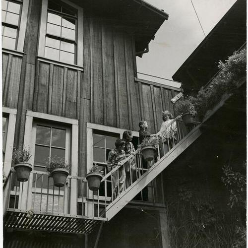 [Four youths at Telegraph Hill Settlement House]