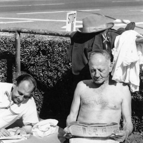 [Anthony Rosinski (left) and Ernest Noetzel sunbathe in Union Square]