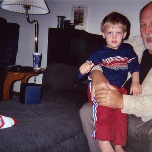 [A man holding his grandson, Alex]