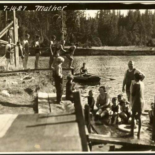 [Families playing on the banks of Birch Lake at Camp Mather]