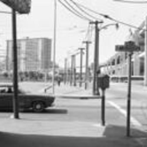 [Corner of Mission and Embarcadero looking north, view of bus stops, plaza, and apartment towers]