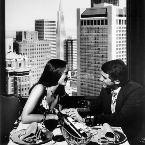 [Two people dining at Victor's restaurant atop the St. Francis Hotel]