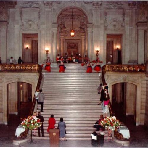[Dancers performing on the main staircase of the Rotunda at City Hall]