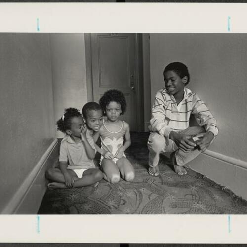 Randall Woodruff (right) babysitting his three siblings