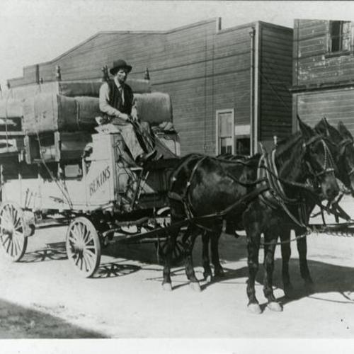 [Helen's father driving Bekins Company horse drawn carriage]