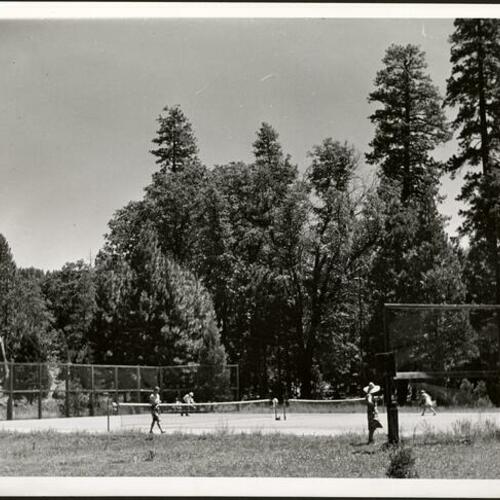 [Campers playing tennis at Camp Mather]