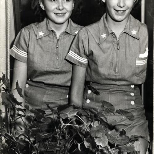 [Iris Farrell and Phyllis Comber wearing the new Girl Reserve camp outfits]