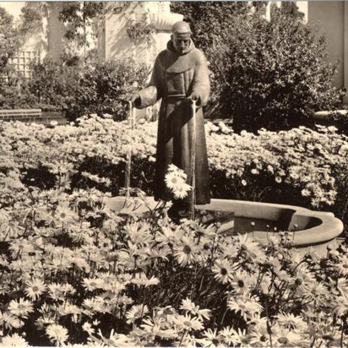 [Statue representing St. Francis of Assisi, after whom the city of San Francisco was named, is located in the flower garden of the Tower of the Sun, Golden Gate International Exposition on Treasure Island]
