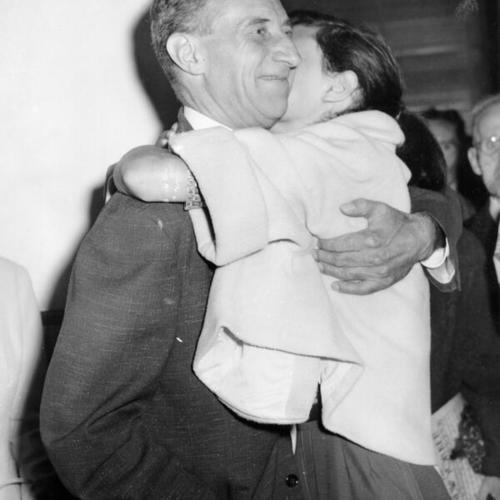 [Harry Bridges embraces his daughter Julie]