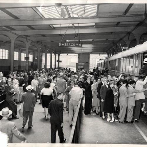[Passengers boarding trains at the San Francisco Oakland bridge terminal]