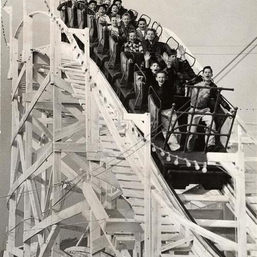 [Members of the Columbia Park Boys' Club riding the roller coaster at Playland at the Beach]