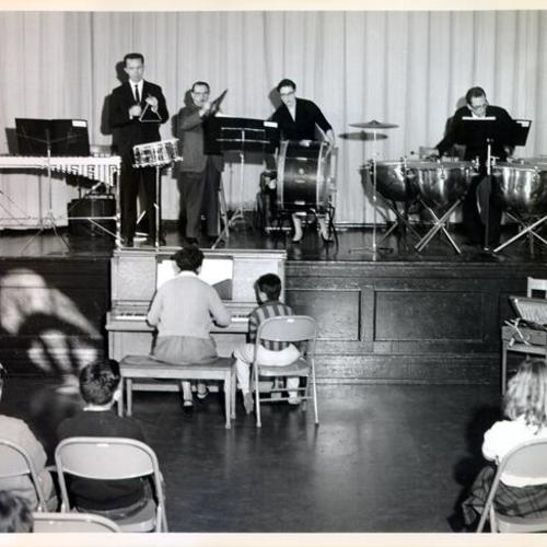 [Musicians on stage at a "Young Audiences" performance at Monroe School]
