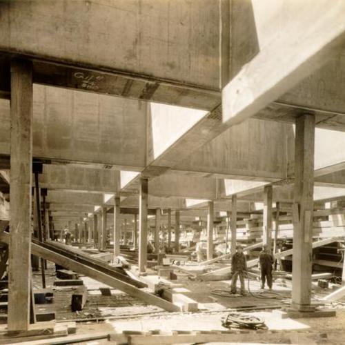 [View of the underside of a large bridge caisson used during construction of the San Francisco-Oakland Bay Bridge]