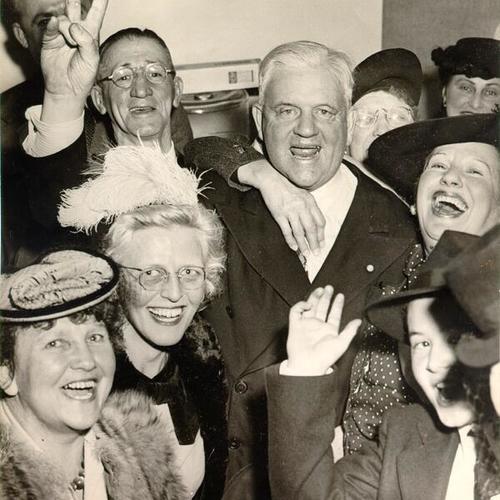 [Roger D. Lapham celebrating with friends after winning election for mayor]