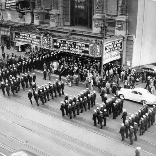 [Parade passes by the Fox theater]