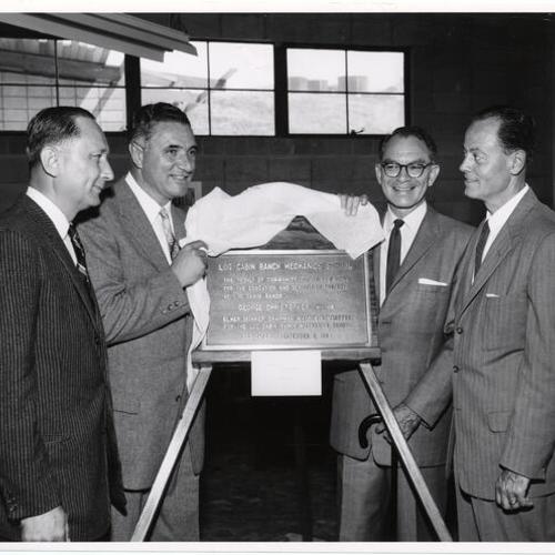 [Mayor George Christopher unveiling a plaque at the dedication of the Log Cabin Ranch School for Boys]