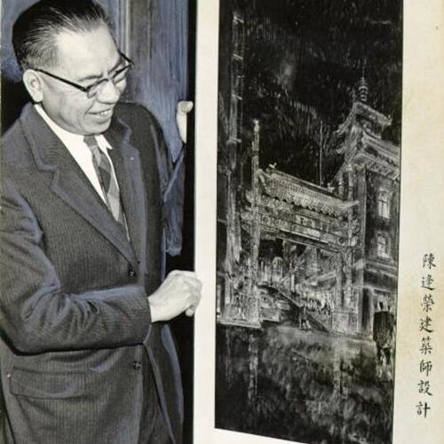 [Rev. T. T. Taam holding up preliminary drawings of Chinese archways]