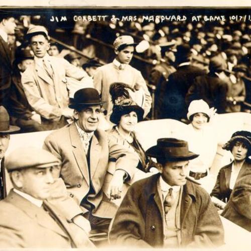 [Boxer Jim Corbett (center) and Blossom Seeley (wife of Rube Marquard) to Corbett's left at Game One of the 1913 World Series at the Polo Grounds New York (baseball)]