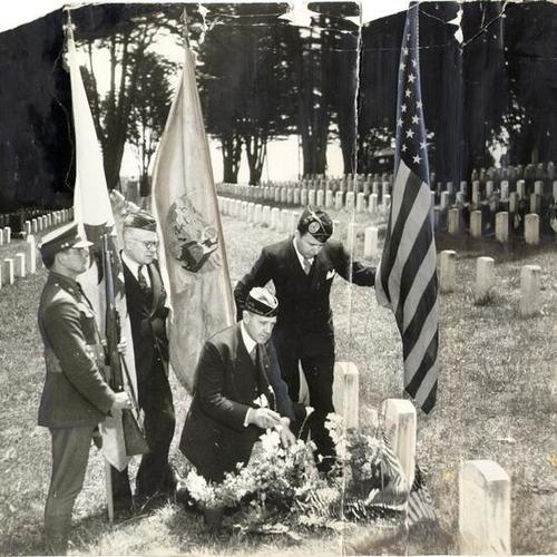 [Private Ellis Thorpe, J.W. Warney, Al Boss, and Eugene Peckham visiting the National Cemetery on Memorial Day]